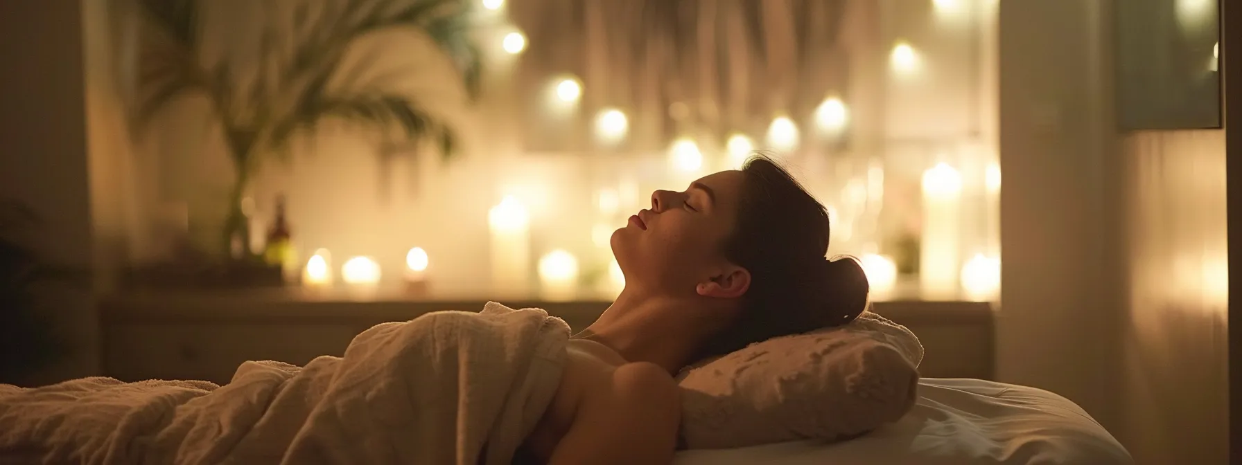 a serene massage room with soft lighting and comforting aromas, featuring a skilled therapist using a variety of techniques to promote relaxation and enhance overall wellness.