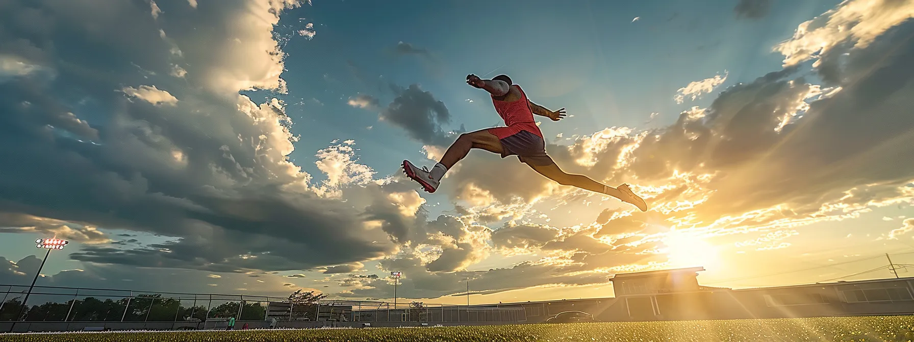 an athlete performing a victorious leap on the sports field after recovering from injury, showcasing the success of atlanta chiropractic care.