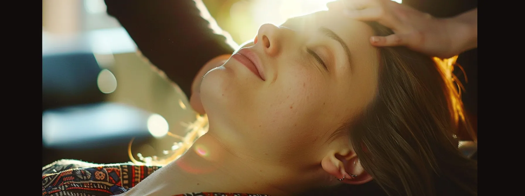 a woman receiving a gentle chiropractic adjustment to alleviate her recurring migraines.