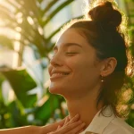 a serene smiling woman receiving a gentle chiropractic adjustment in atlanta, surrounded by soothing natural light and lush green plants.