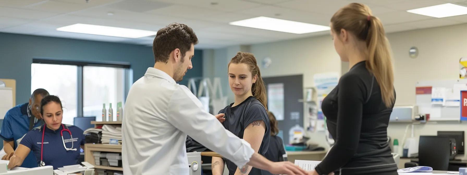 a chiropractor assessing an athlete's shoulder flexibility, collaborating with other health professionals in a bright, spacious clinic.