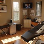 a sports chiropractor in atlanta using advanced therapy equipment to aid in injury recovery.